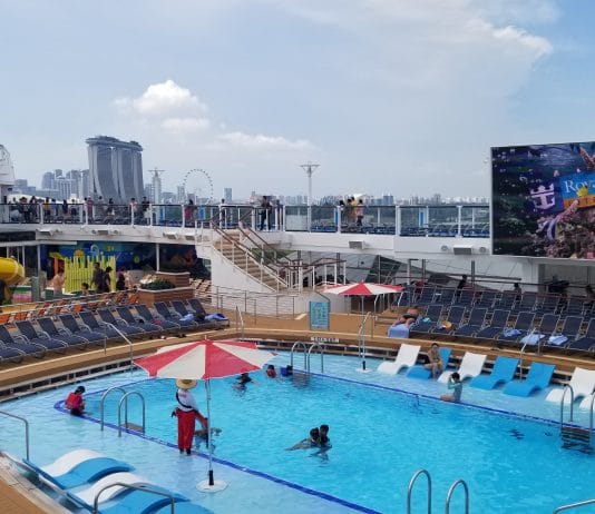 World’s Largest Cruise Line Resumes Cruises on One Ship Royal Caribbean cruise ship in Singapore
