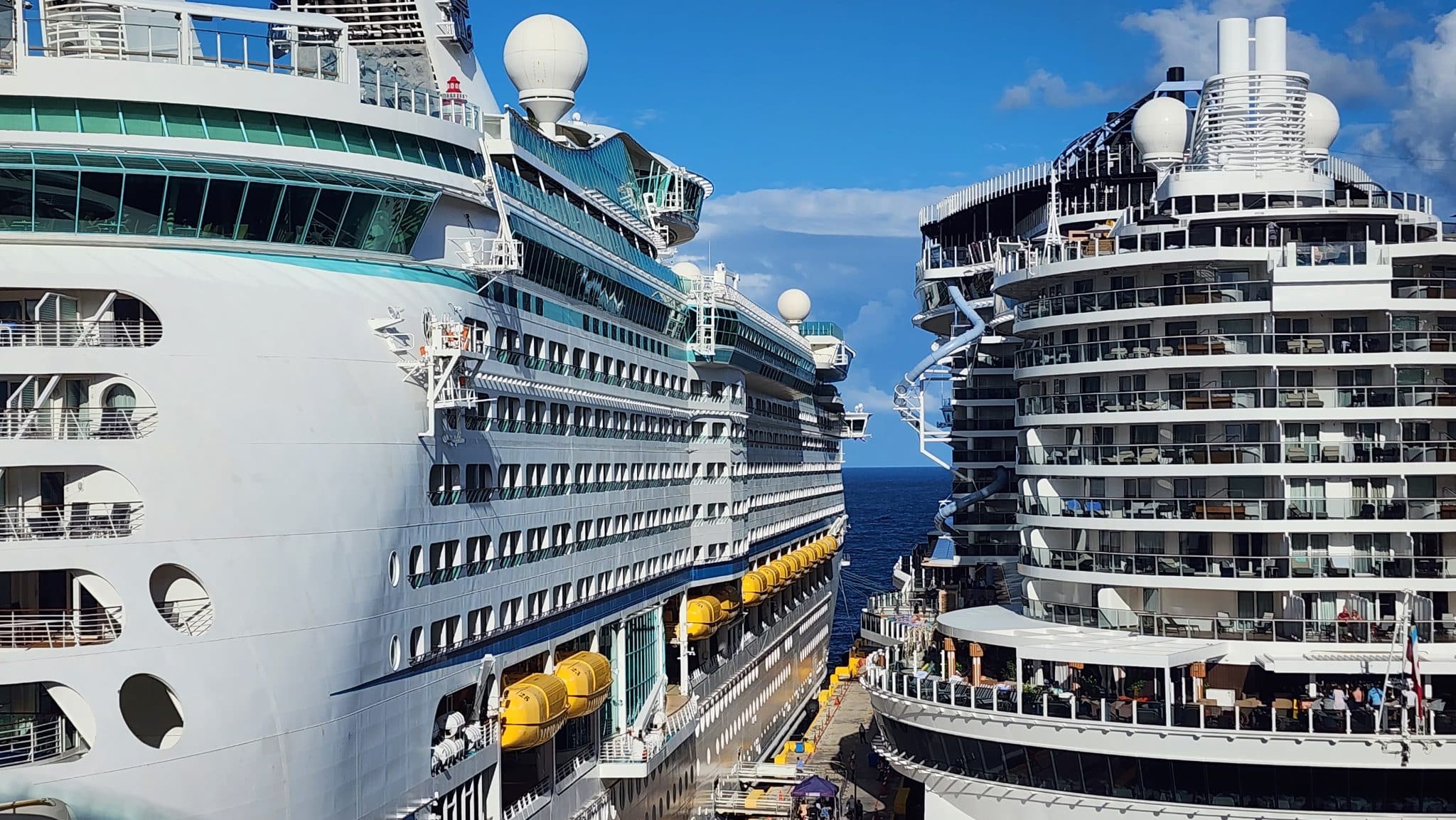 2 cruise ships docked side by side