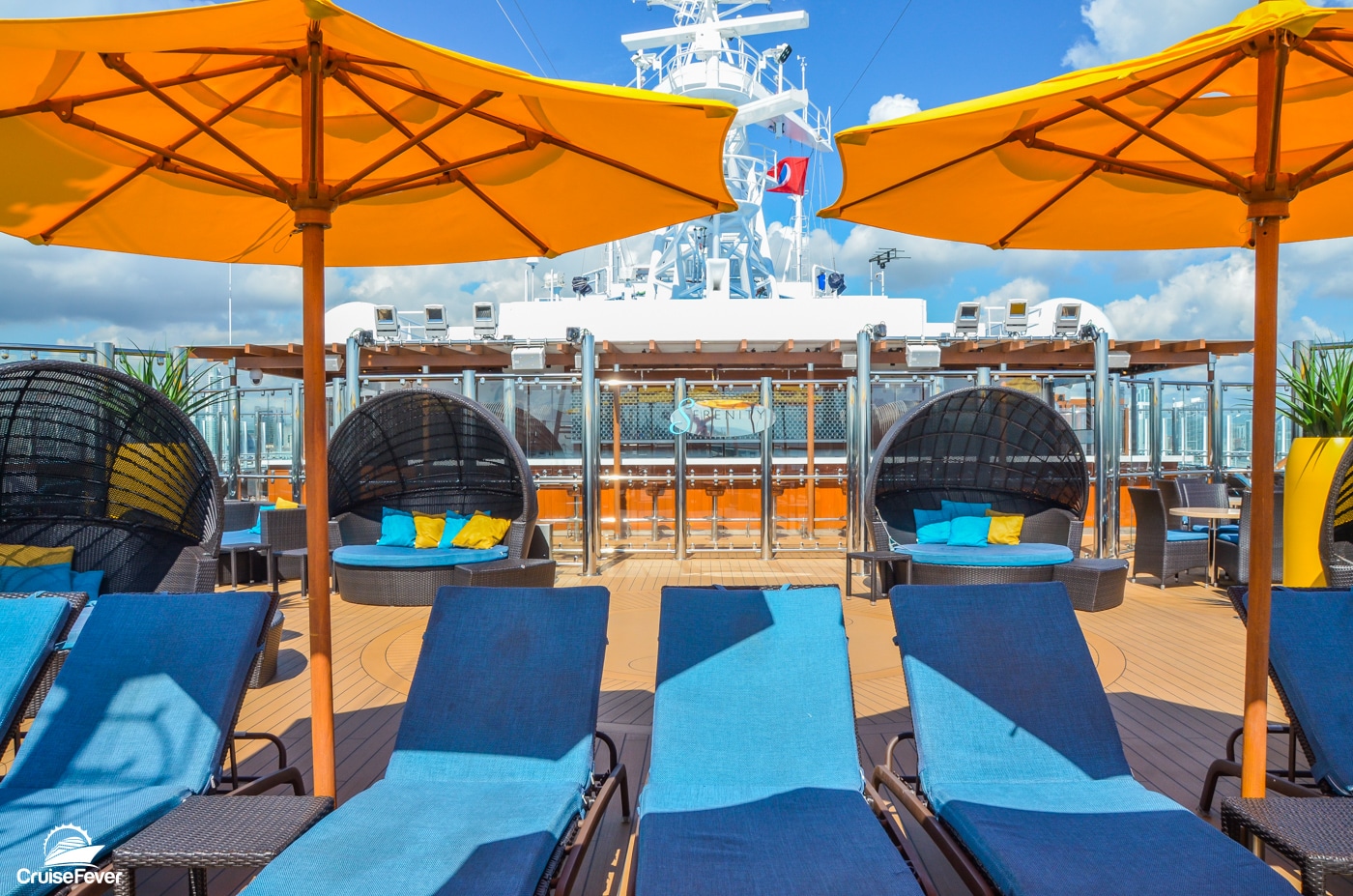 loungers and umbrellas on pool deck of Carnival Horizon cruise ship