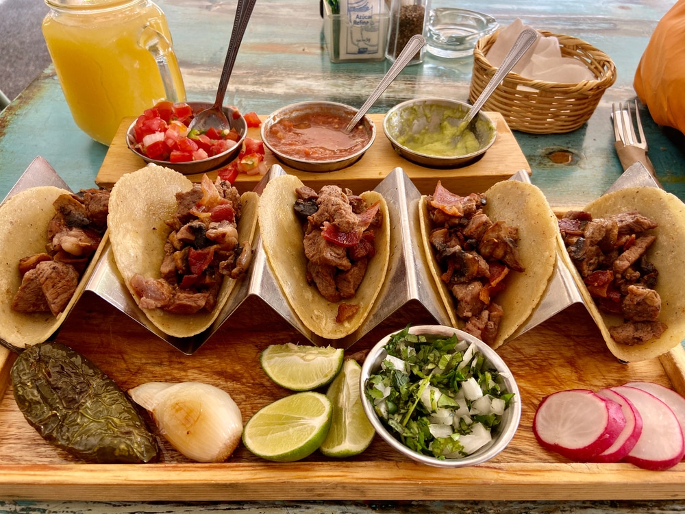 Some tacos and ingredients for outdoor vendor in Mexico