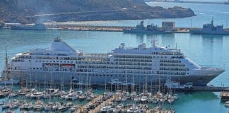 silversea luxury cruise ship in port by boats at marina