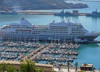 silversea luxury cruise ship in port by boats at marina