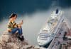 woman using cell phone near a cruise ship in port