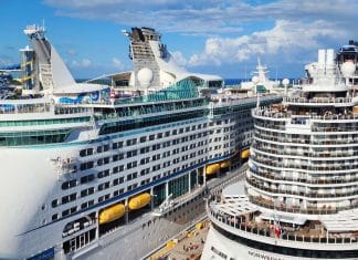 two cruise ships docked in port: Royal Caribbean and MSC Cruises