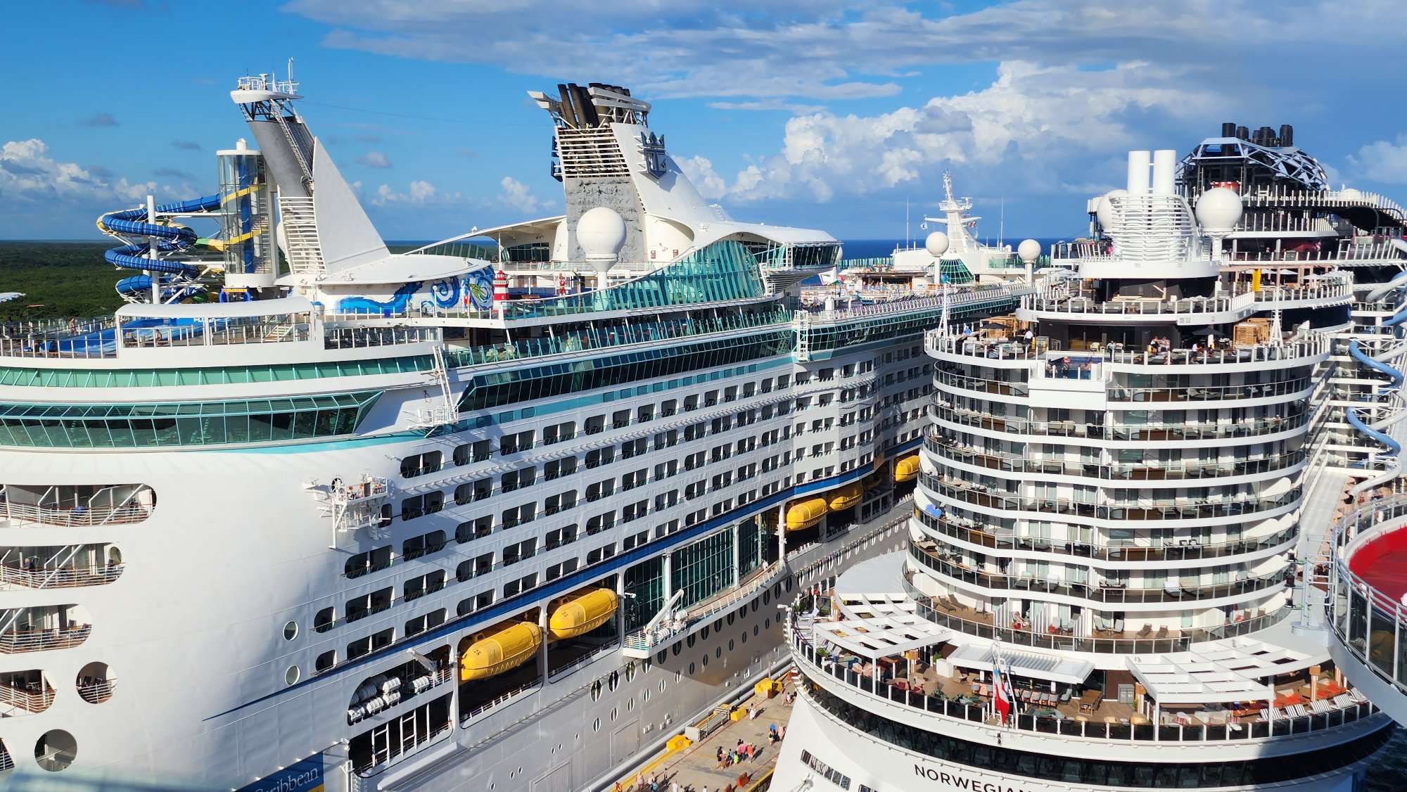 two cruise ships docked in port: Royal Caribbean and MSC Cruises