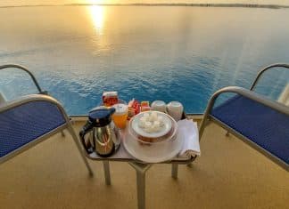 norwegian escape balcony with room service breakfast at sunrise