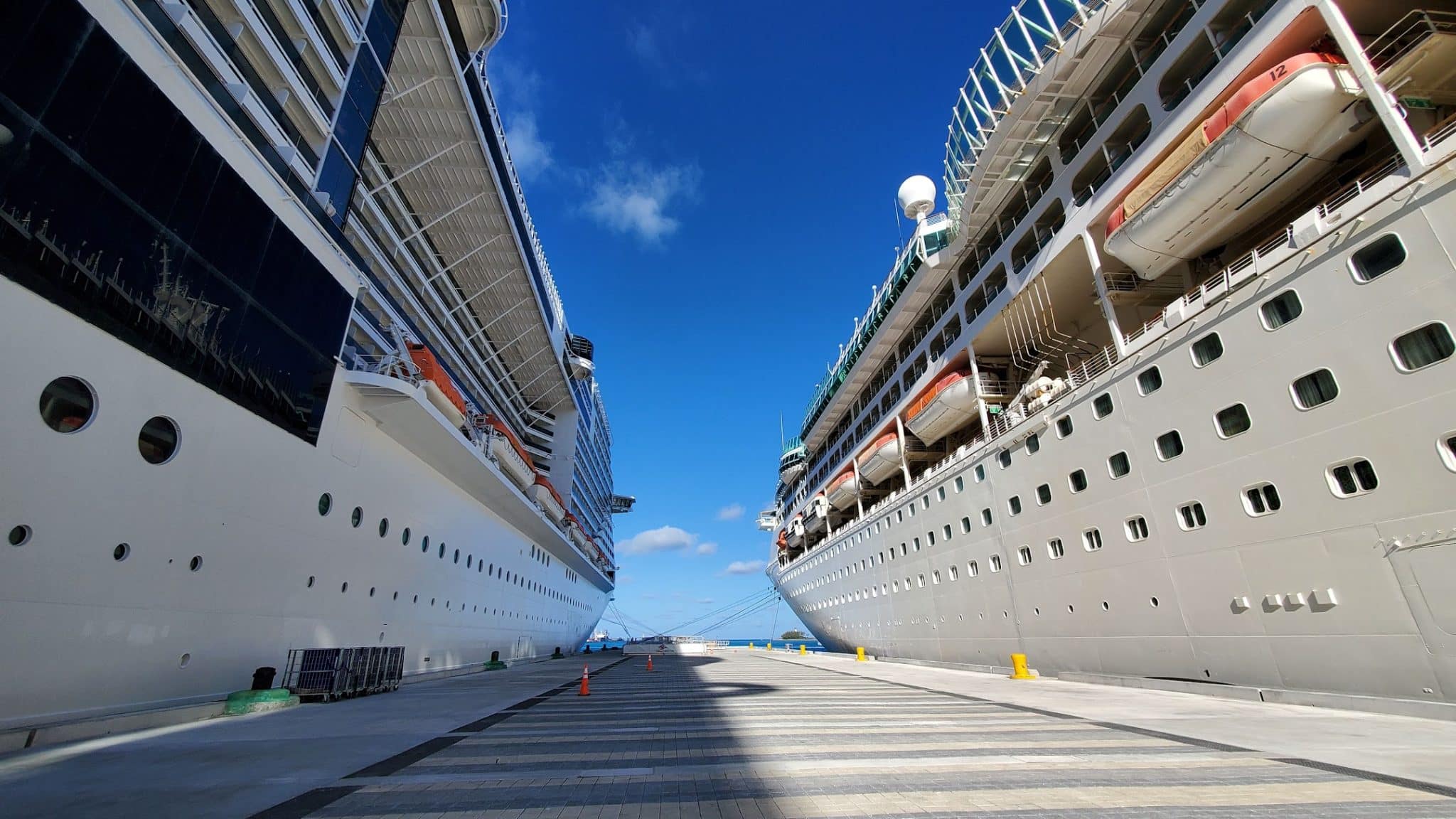two cruise ships docked: cruise travel insurance