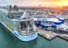 Allure of the Seas cruise ship in port at Galveston Texas showing city in background