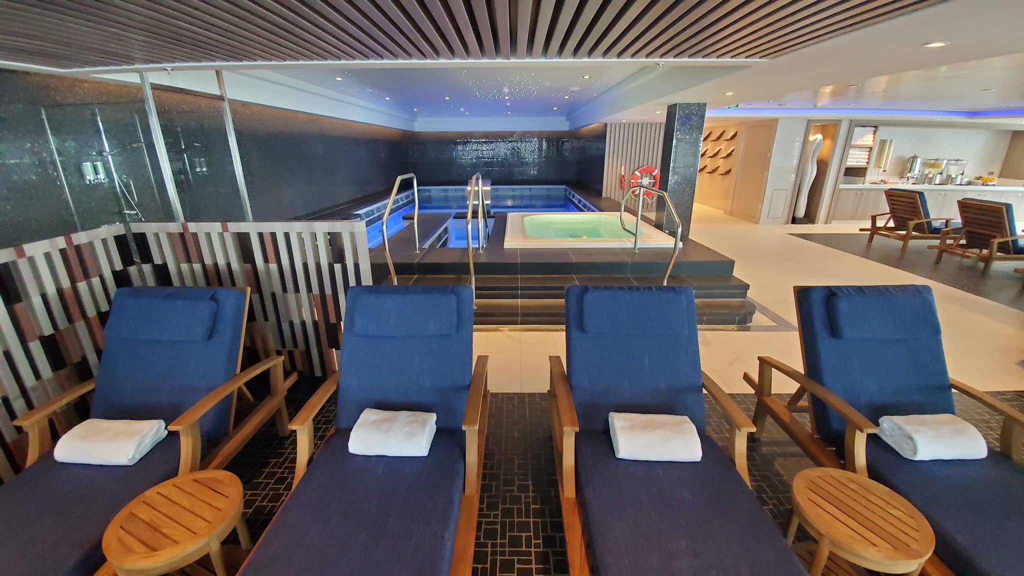 A thermal suite on the Norwegian Encore with a relaxation area with a private pool