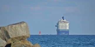 Celebrity cruise ship sailing off into the sea