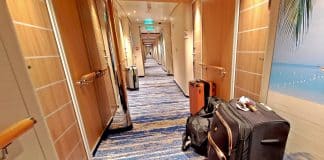 Cruise ship luggage in a hallway on a Carnival cruise ship