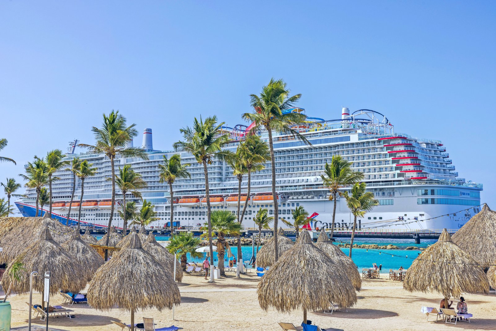 Carnival cruise ship pin port with palm trees and loungers