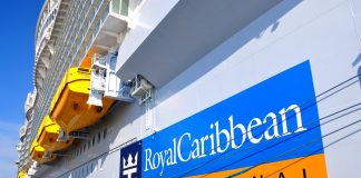 Royal Caribbean logo on cruise ship in port