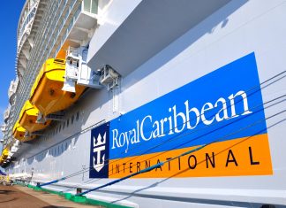 Royal Caribbean logo on cruise ship in port