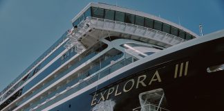 Bottle breaking against EXPLORA III