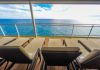 Padded loungers on cruise ship near spa