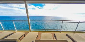 Padded loungers on cruise ship near spa